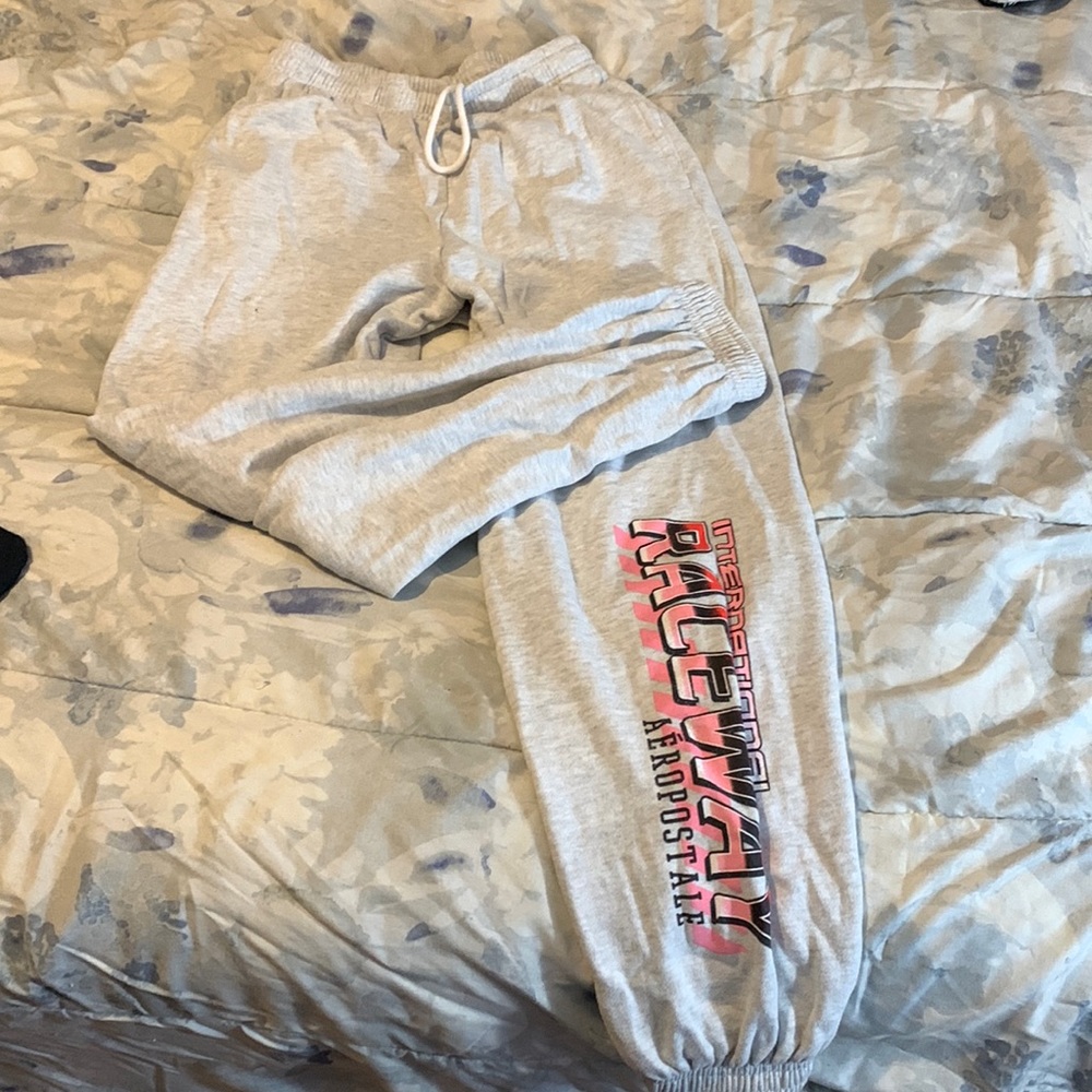 Light grey aero joggers w/ pink lettering down one leg